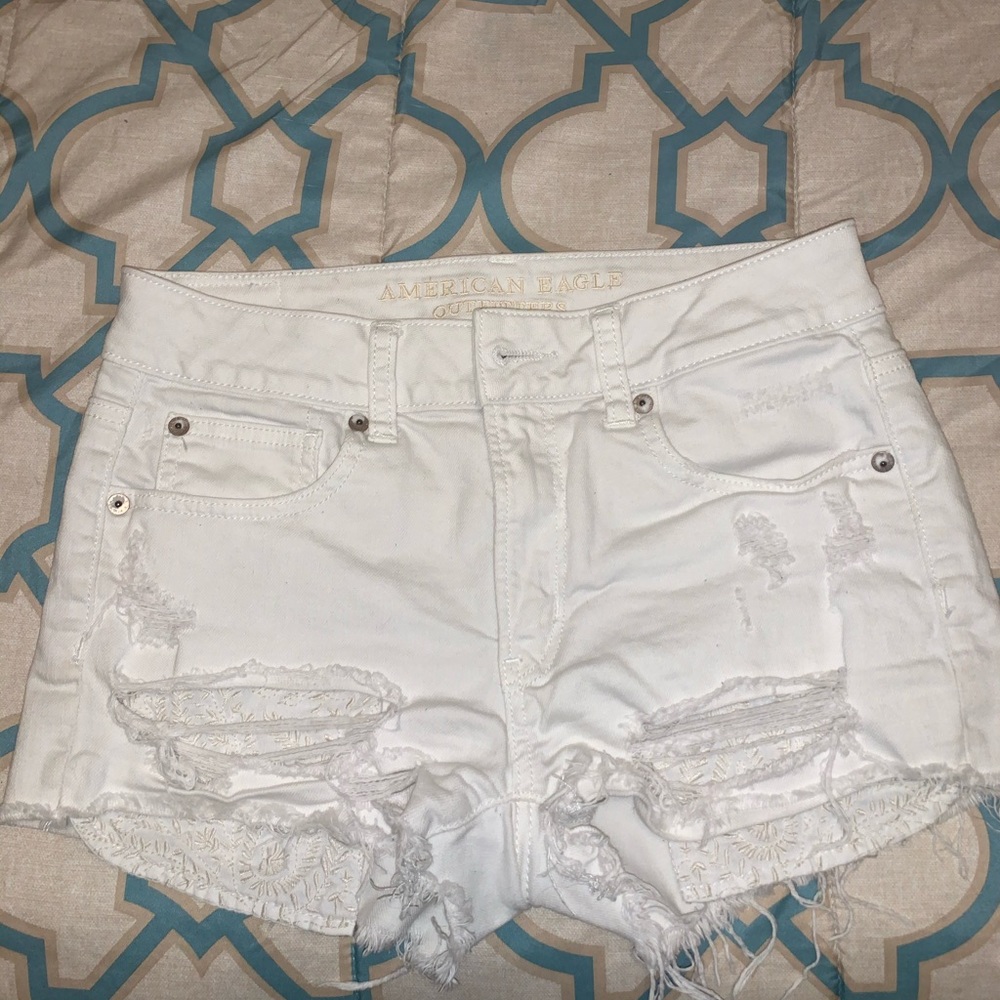 American eagle white hi rise distressed shorts.